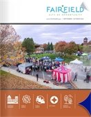 Trees lit with Christmas lights in a snowy Village Green Park, on the cover of the November/December Fairfield Flyer