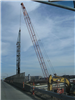 Workers Driving Piles for the Foundation of the Widened Bridge