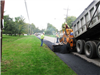 Day One: Before our trusty photographer could get to the scene, crews had milled and excavated the existing pavement and begun filling the void with asphalt