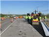 New asphalt is put down along Port Union Road facing the Bypass