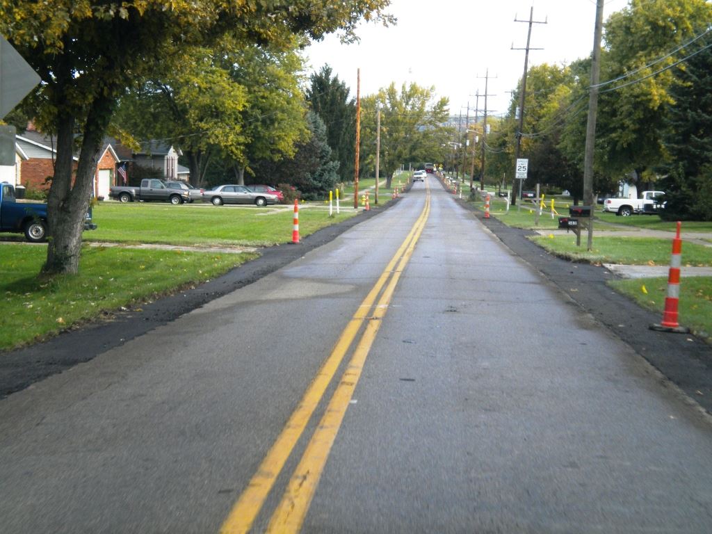 A widened stretch of Gray Road awaits a fresh layer of pavement